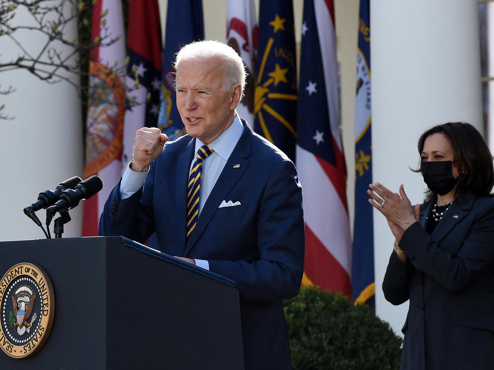 President Biden, with Vice President Harris behind him, speaks about the American Rescue Plan in the Rose Garden of the White House on Friday.
