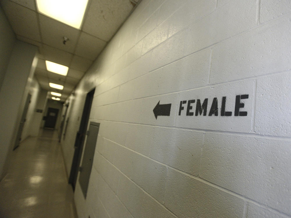 A sign points toward the women's section of the Huntington Beach jail. The National Council for Incarcerated and Formerly Incarcerated Women and Girls is appealing to President Biden to grant clemency to 100 women during his first 100 days in office.