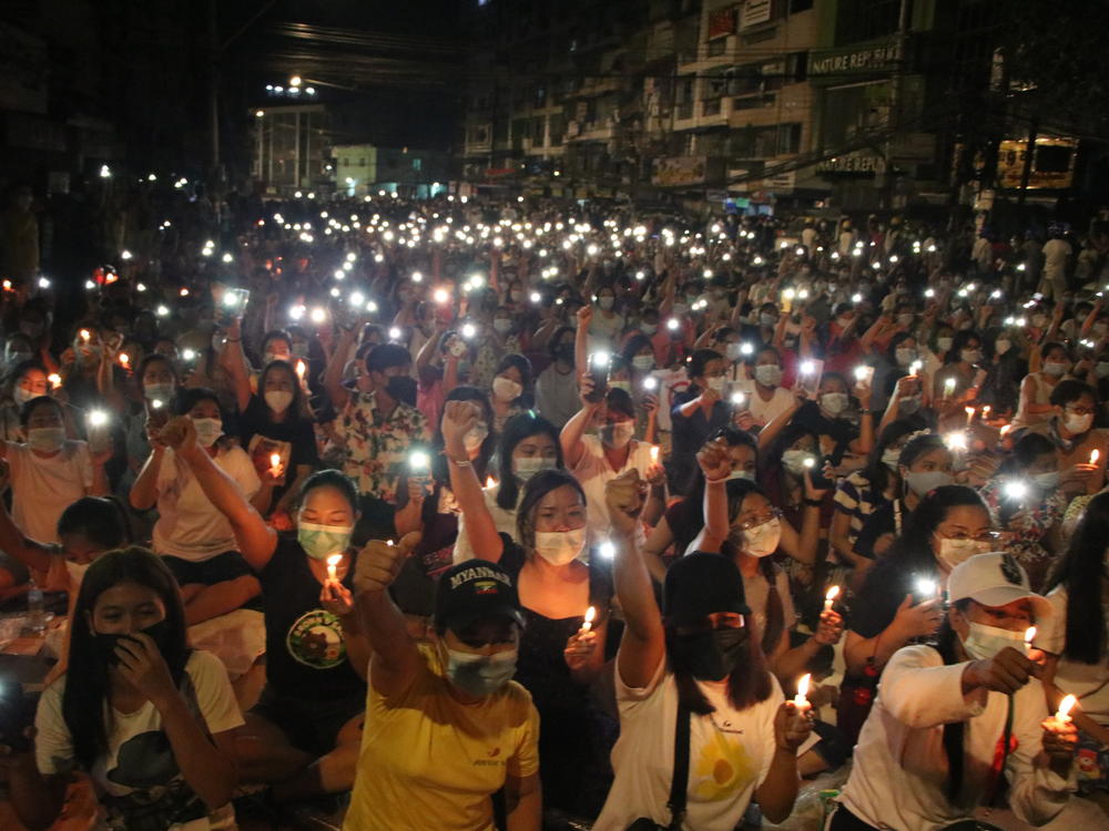 Protesters against last month's military coup hold a candlelight rally in Yangon, Myanmar, on  Saturday. More than 70 people have been killed by security forces since the military overthrew the country's fragile democracy six weeks ago, a United Nations official says.