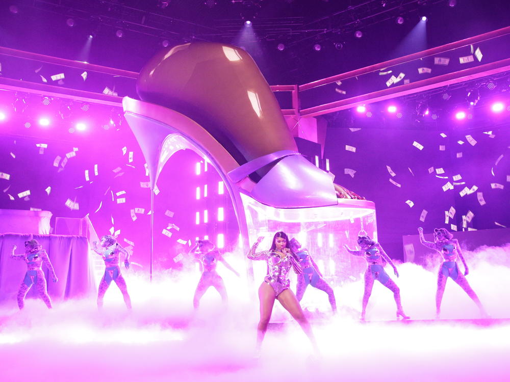 Megan Thee Stallion, who took home the awards for best new artist and two rap categories, performs with Cardi B at the 2021 Grammy Awards ceremony.