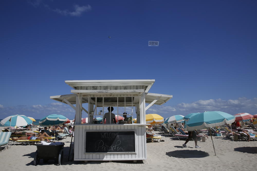 In the course of NPR's reporting from Miami Beach, masks appeared on visitors' chins and in pockets more often than on their faces.