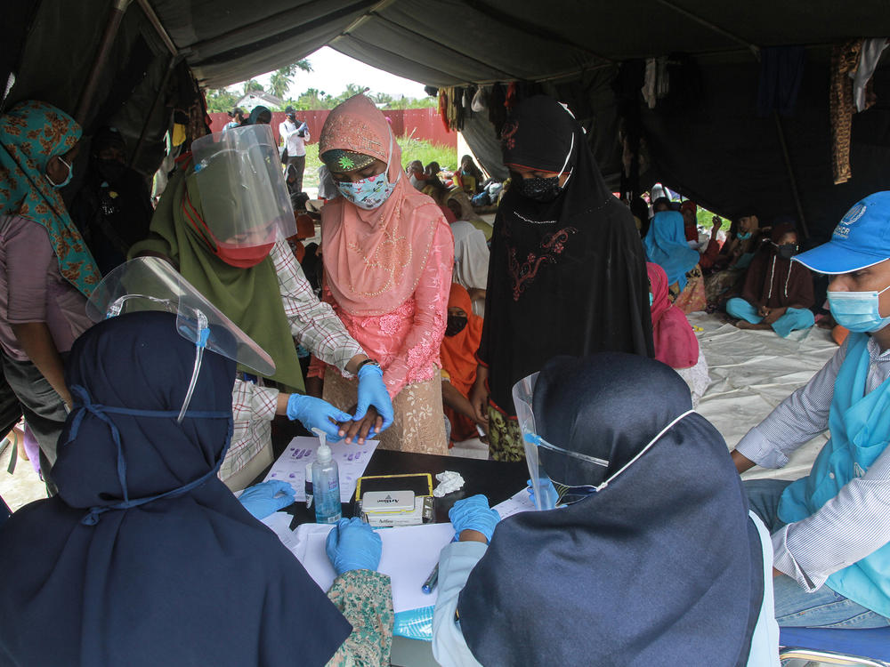 Rohingya refugees at a work training center in Indonesia's Aceh province. Dr. Paul Spiegel of Johns Hopkins University's Center for Humanitarian Health is looking at the data that have been collected on refugees and other vulnerable populations. It's far from complete, he says, but he has been surprised by the impact of COVID-19 among Rohingya.