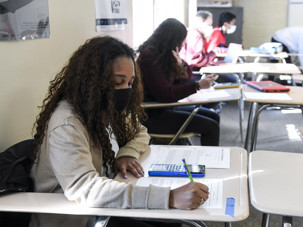Giani Clarke, 18, a senior at Wilson High School in West Lawn, Pa., takes a test in her AP statistics class earlier this month. The desks are doubled as a way to provide more social distancing.