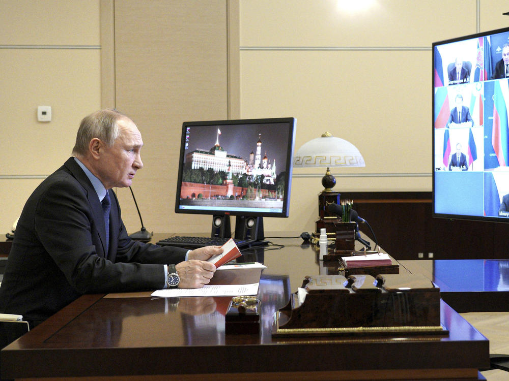 Russian President Vladimir Putin authorized a campaign to help former President Donald Trump and undermine President Biden in last year's election, according to U.S. intelligence. Putin is shown here on March 12 at a residence outside Moscow.