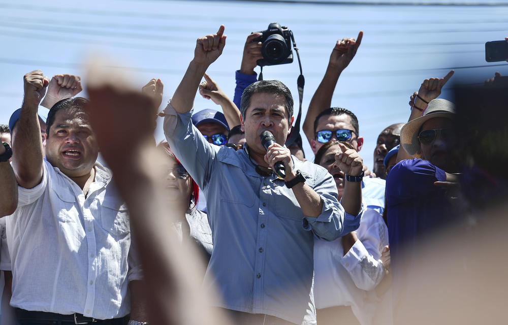 Honduran President Juan Orlando Hernández speaks to his supporters in Tegucigalpa, on Oct. 20, 2019. He spoke after opposition parties in Honduras accused him of running a drug and corruption network and called for street protests to demand the president step down.