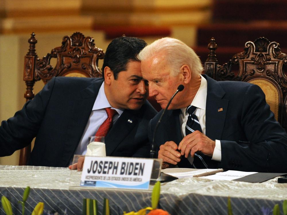 Honduran President Juan Orlando Hernández (left) speaks with then-Vice President Biden during a news conference in Guatemala City on March 2, 2015. Leaders from Guatemala, El Salvador and Honduras were meeting with Biden for two days of talks about child migrants entering the United States.