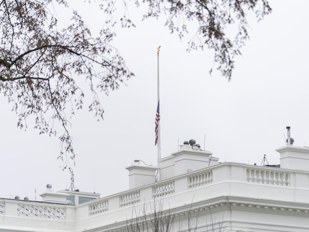 The American flag files at half-staff at the White House on Thursday.