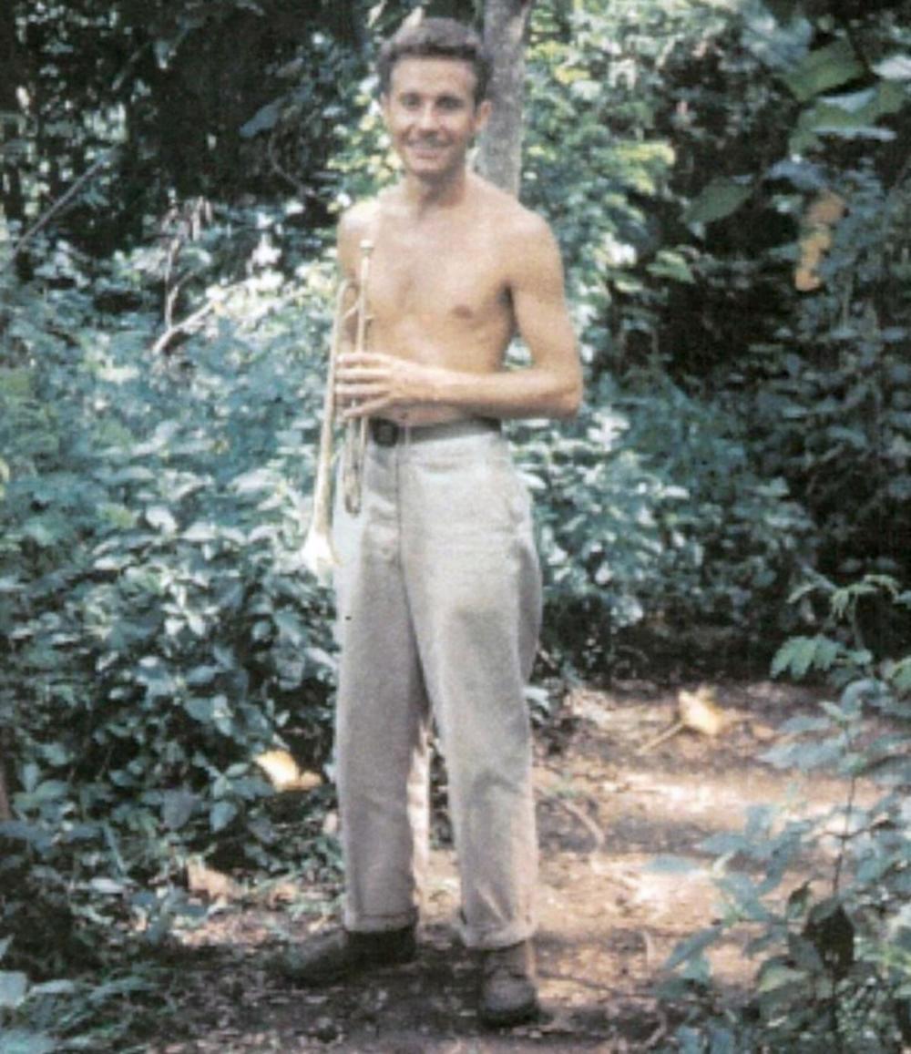 Richard Burt would walk into the jungle outside of camp to avoid waking other WWII servicemembers with his trumpet practice. Here, he returns from a practice session in 1945 in the Philippines.