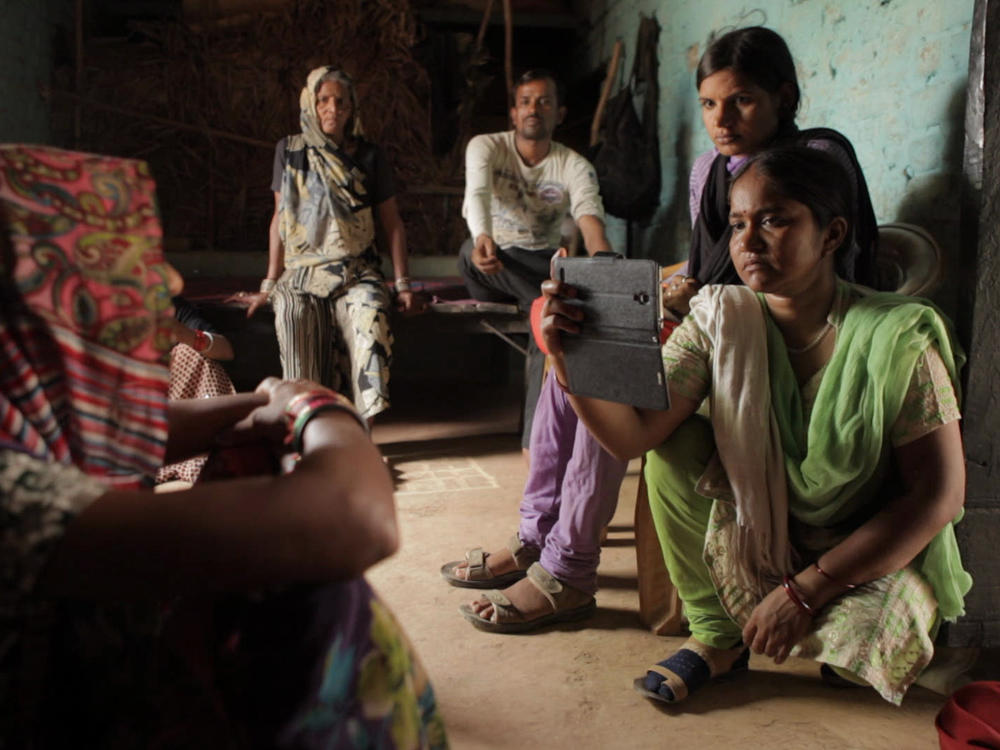 The award-winning documentary <em>Writing with Fire</em> follows Meera Devi (right), chief reporter for the <em>Khabar Lahariya —</em> a news publication run by Dalit, members of India's lowest caste.<em> </em>
