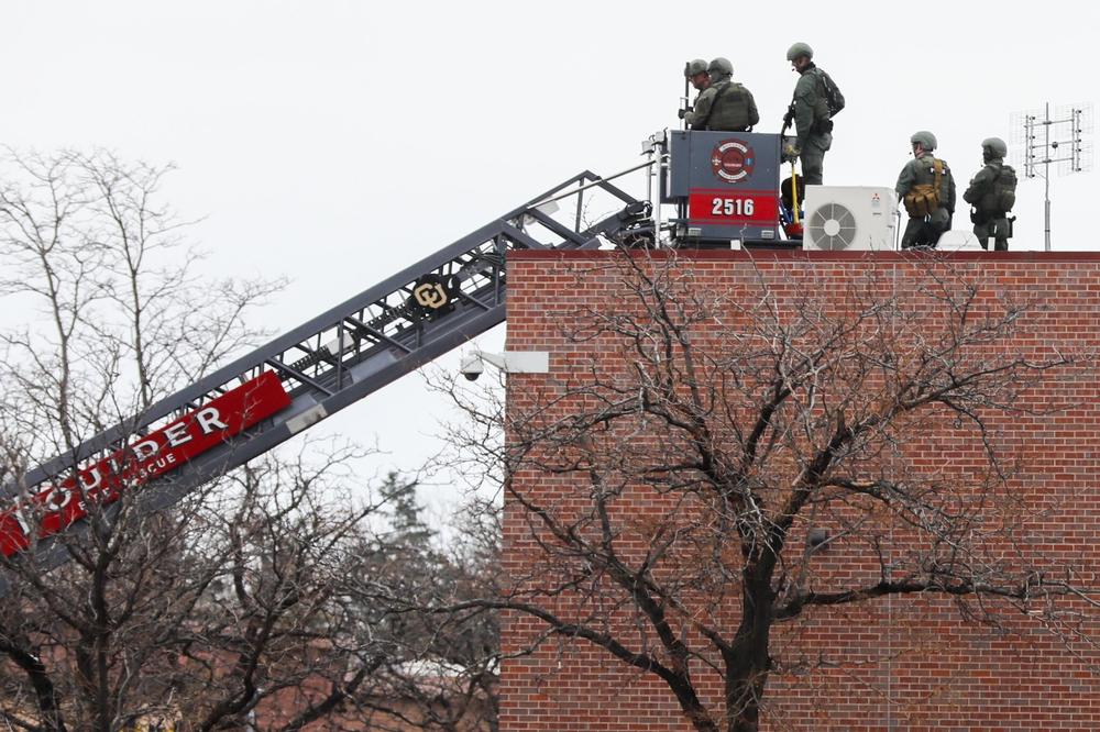 Law enforcement on the roof of the King Soopers store Monday in Boulder.