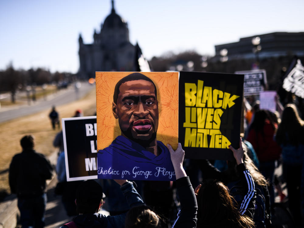 Opening arguments are slated to begin in former Minneapolis police officer Derek Chauvin's murder trial on March 29. Here, people march near the Minnesota state Capitol to honor George Floyd on Friday in St. Paul, Minn.