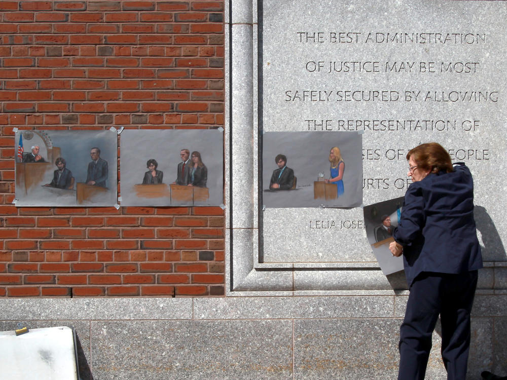 The U.S. Supreme Court will review a lower court's decision from last summer that vacated the six death sentences imposed on Boston Marathon bomber Dzhokhar Tsarnaev. Here, artist Jane Flavell Collins pulls down her courtroom sketches outside the Moakley U.S. Courthouse in Boston after Tsarnaev was sentenced.