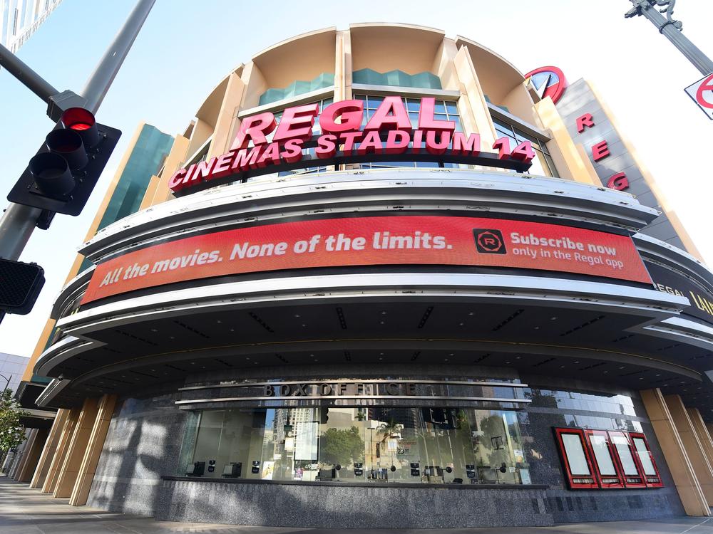 Regal Cinemas says it will reopen its U.S. theaters next month. A closed box office is seen here in Los Angeles in June after theaters were closed due to the pandemic.