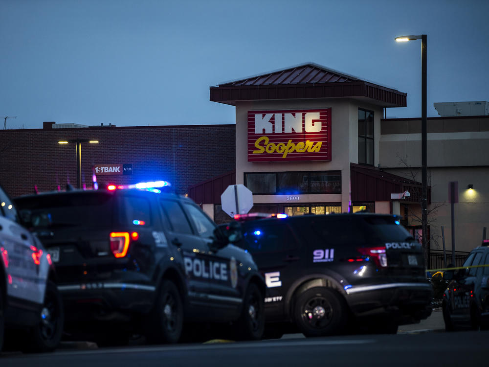 Police respond to an attack on a King Soopers grocery store in Boulder, Colo., where a gunman opened fire Monday. Ten people, including a police officer, were killed.