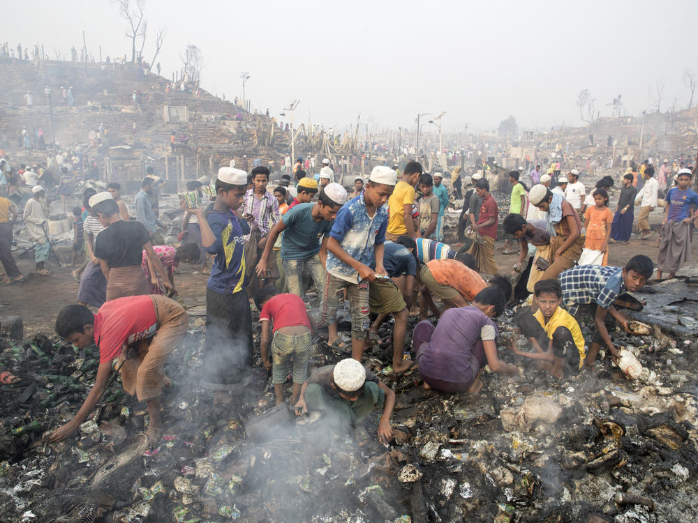 Rohingya refugees search for their belongings after a massive fire broke out at the Balukhali refugee camp, Cox's Bazar, Bangladesh, on Monday.