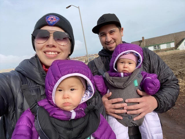 Cara Lestenkof-Mandregan, John Melovidov and their twin daughters, Anna and Mila, go for a walk on St. Paul Island, Alaska.