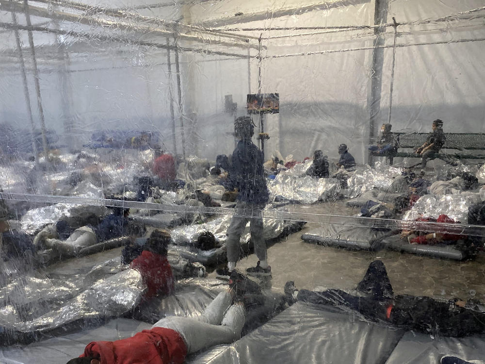 This March 20 photo provided by the Office of Rep. Henry Cuellar, D-Texas, shows detainees in a Customs and Border Protection (CBP) temporary overflow facility in Donna, Texas. President Biden's administration faces mounting criticism for refusing to allow outside observers into facilities where it is detaining thousands of immigrant children.