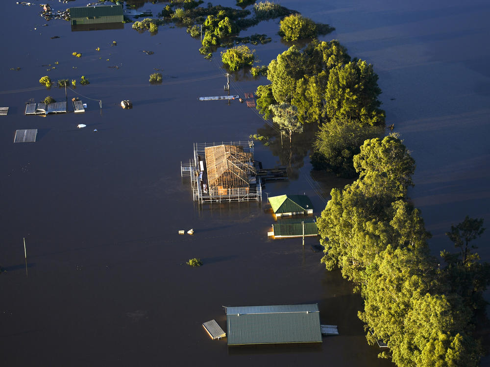 Buildings are partially submerged as floodwater covers large areas of northwest of Sydney on Wednesday.