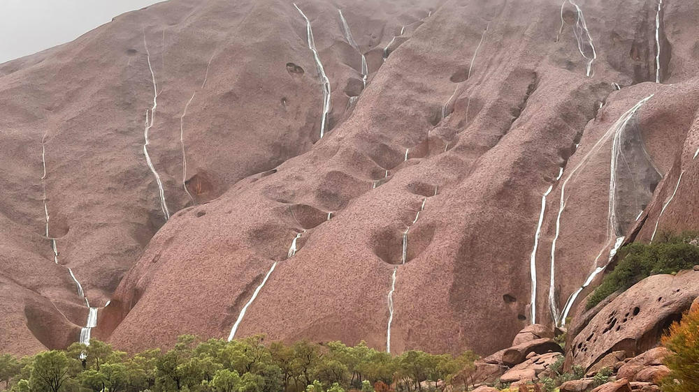 Multiple waterfalls from heavy rains cascade over the rock formations at the Uluru-Kata Tjuta National Park in the Northern Territory, Australia, earlier this week.