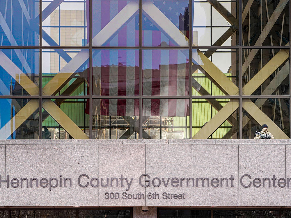 A member of the Minnesota National Guard stands outside the Hennepin County Government Center during jury selection in the trial of former Minneapolis police officer Derek Chauvin on March 11 in Minneapolis. Chauvin is facing murder charges in George Floyd's death. Among the 12 jurors and three alternates selected are three Black men, one Black woman and two multiracial jurors.