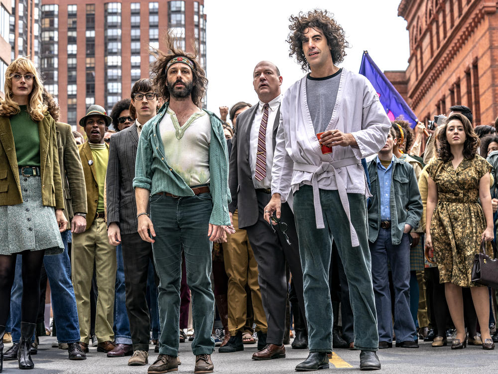 Sacha Baron Cohen, front right, plays Abbie Hoffman in <em>The Trial of the Chicago 7.</em>