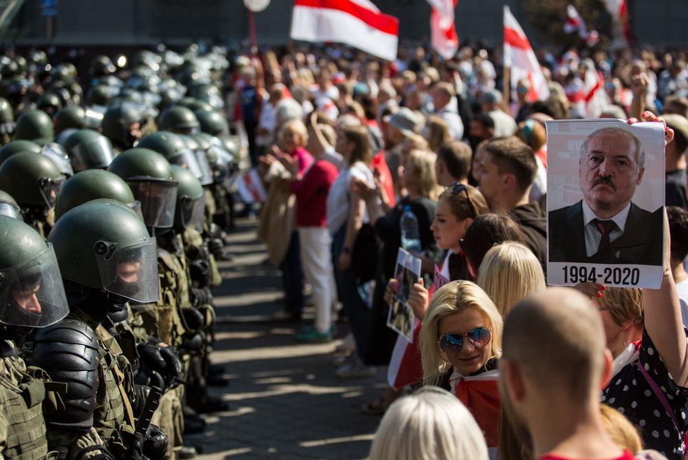 Belarusian security forces block a street during a protest against disputed presidential election results in Minsk on Aug. 30. Tens of thousands of opposition supporters marched through the capital that day, calling for an end to strongman Alexander Lukashenko's rule.