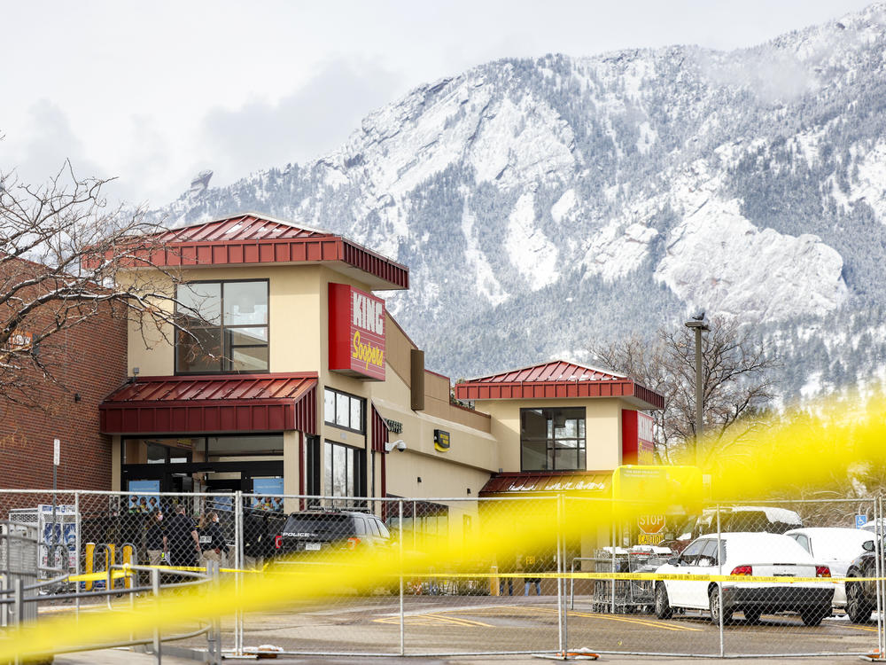 Crime tape surrounds a King Soopers grocery store on March 24 in Boulder, Colo where ten people were killed in a shooting on Monday. State Democrats now say they will consider a statewide assault weapons ban.