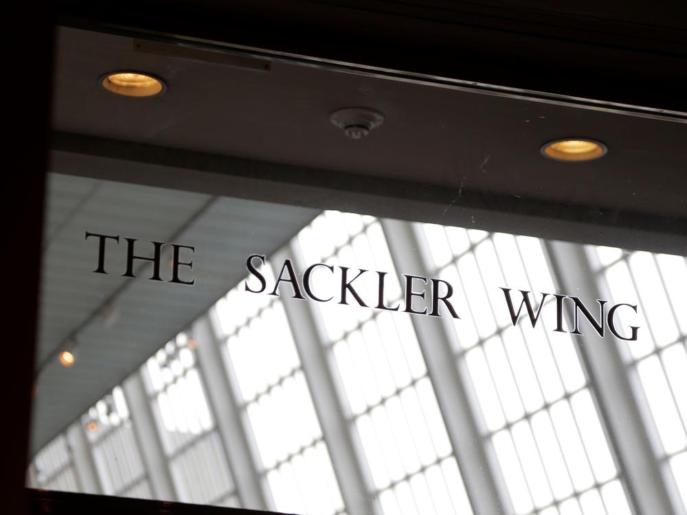 In this Jan. 17, 2019, file photo, a sign with the Sackler name is displayed at the Metropolitan Museum of Art in New York. The Sackler family wealth has become linked to sales of OxyContin, and their company, drug maker Purdue Pharma, is attempting to settle lawsuits over the opioid crisis.