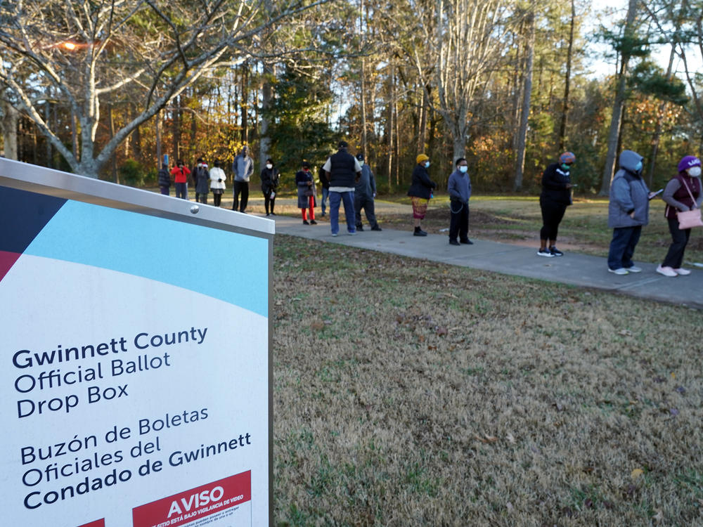 Voters stand in line to cast their ballots during the first day of early voting in the U.S. Senate runoffs at Lenora Park in Atlanta in December 2020.