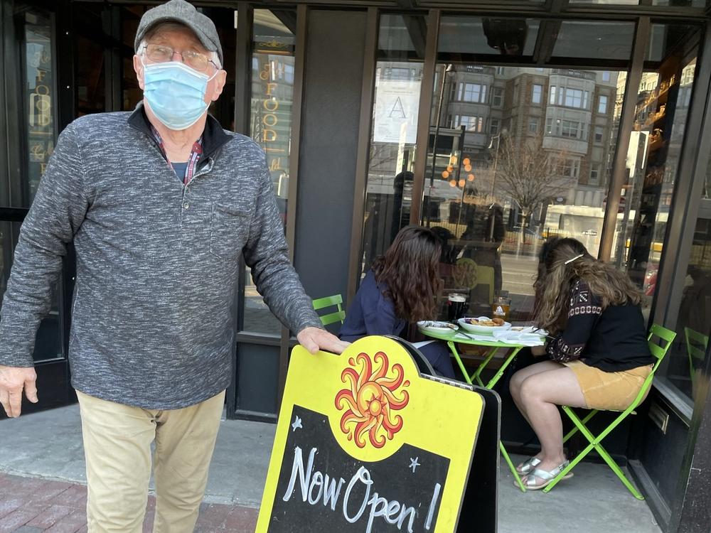 Cornwall's co-owner John Beale sets up sidewalk seating on the first day it's allowed in Boston. He and his wife Pam launched the English-style tavern nearly 40 years ago.