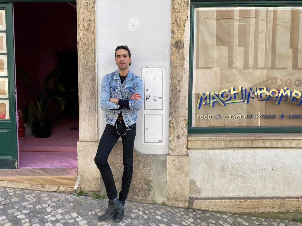 Marcio Duarte, owner of Machimbombo, a small cocktail bar in Lisbon, Portugal, stands outside his establishment. Business has been tough amidst nightlife restrictions during the pandemic.