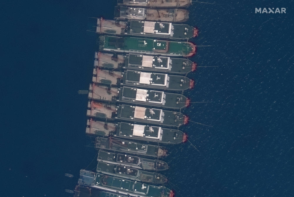 Close-up view of Chinese fishing vessels anchored in the boomerang-shaped Whitsun Reef on March 23. Observers say the decks of the ships are so clean, it's as if they're brand new. South China Sea analysts say the trawlers are part of China's maritime militia, the existence of which China denies.