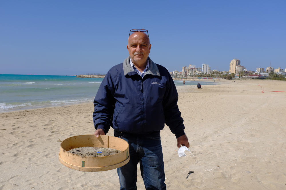 Hassan Dbouk, the mayor of Tyre, stands on Tyre beach, which has been badly polluted by the oil spill.