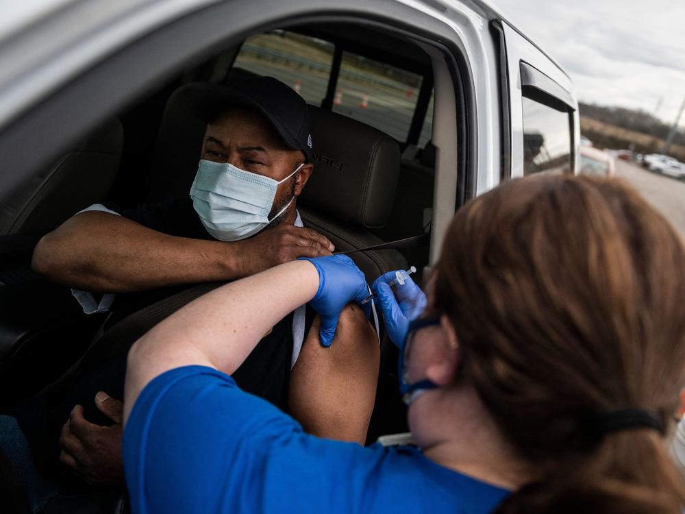 A nurse administers a shot at a COVID-19 mass vaccination site at Martinsville speedway in Ridgeway, Va., on March 12. Ashish Jha, a public health policy researcher, noted Sunday that 