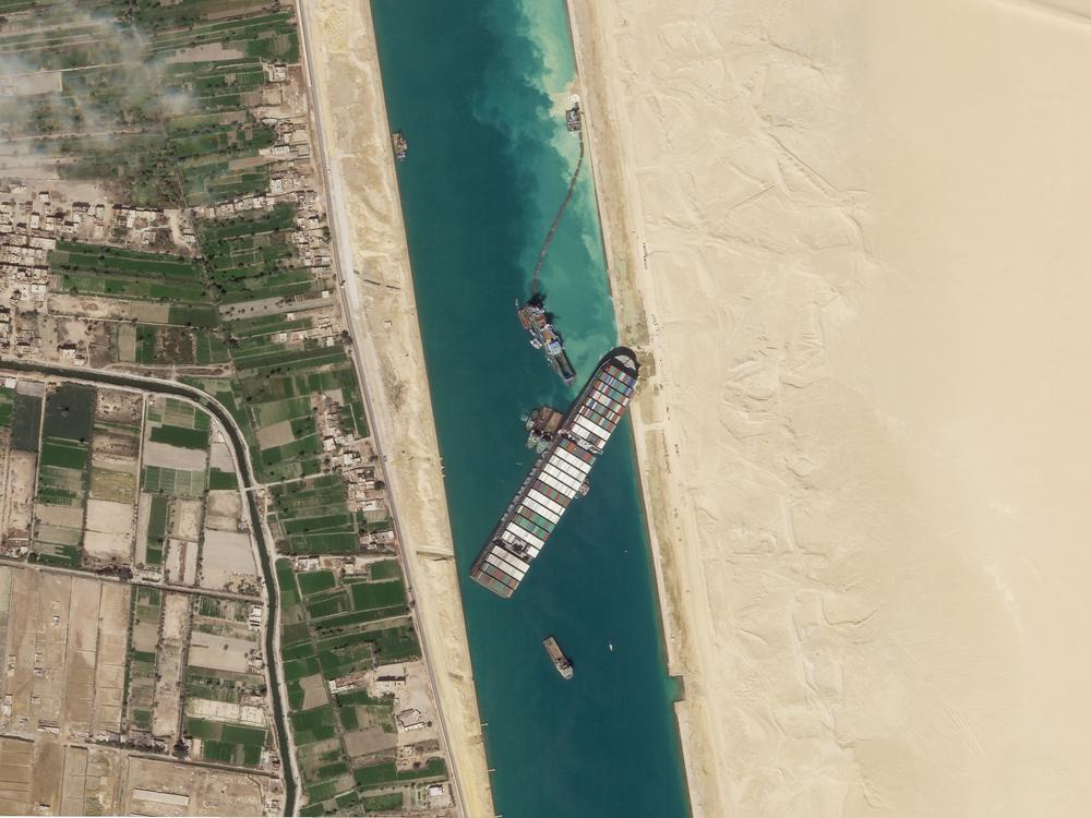 A satellite image shows the container ship Ever Given stuck in the Suez Canal near Suez, Egypt. Attempts to free the mammoth vessel stuck in Egypt's Suez Canal paid off on Monday.