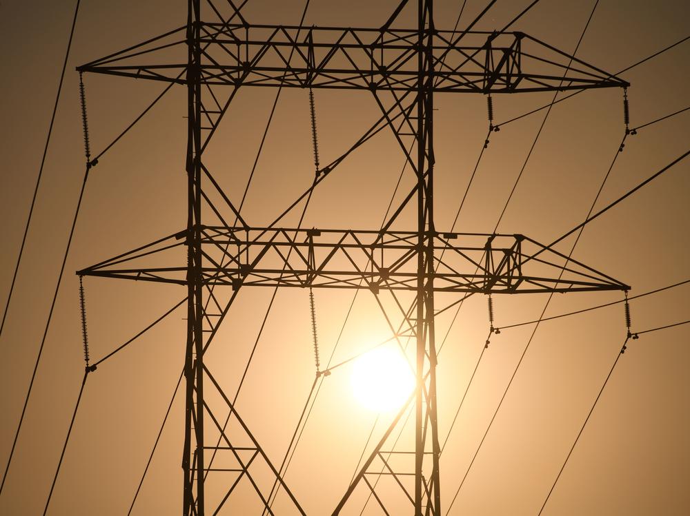 Electrical power line towers are seen in Los Angeles in August. Overdue power bills have mushroomed during the pandemic as job losses mounted and power consumption soared.