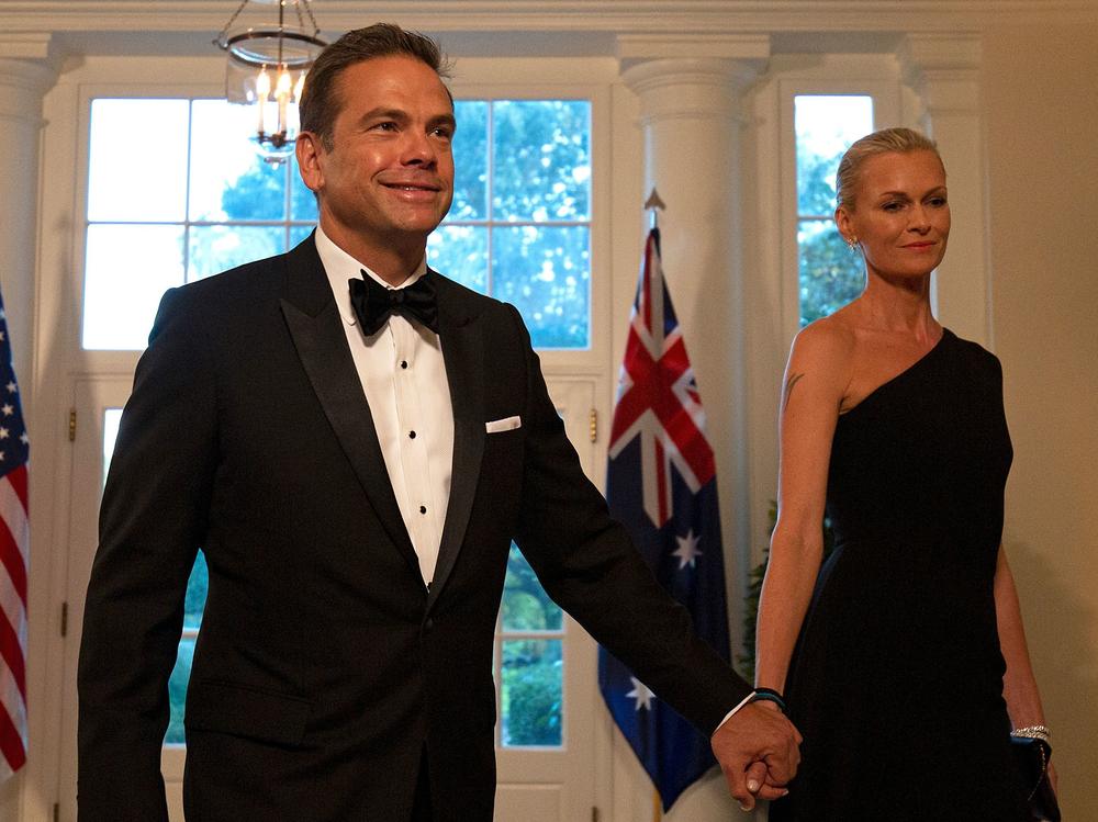 Fox Corp.'s Lachlan Murdoch and his wife, Sarah, arrive at the White House for a 2019 state dinner honoring Australian Prime Minister Scott Morrison. Murdoch and his family have left the U.S. for Sydney through at least the end of summer.