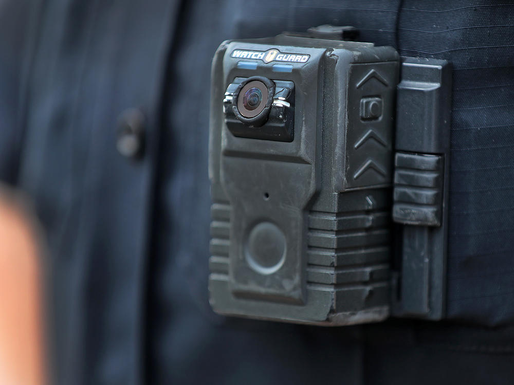Police officer David Moore is pictured wearing a body camera in Ipswich, Mass., on Dec. 1, 2020. The city was among 25 statewide awarded grants to purchase body-worn cameras for videotaping interactions with the public. A new study says the benefits to society and police departments outweigh the costs of the cameras.