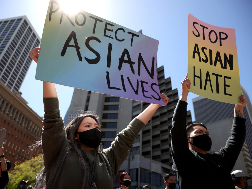 Protesters hold signs during a rally to show solidarity with Asian Americans at Embarcadero Plaza in San Francisco on March 26. The White House has unveiled new measures to address violence and harassment against the AAPI community.