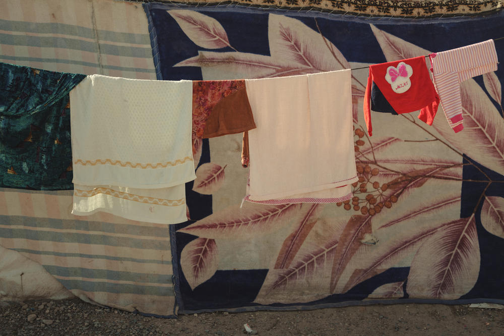 Laundry dries on a line in the Khanke camp.