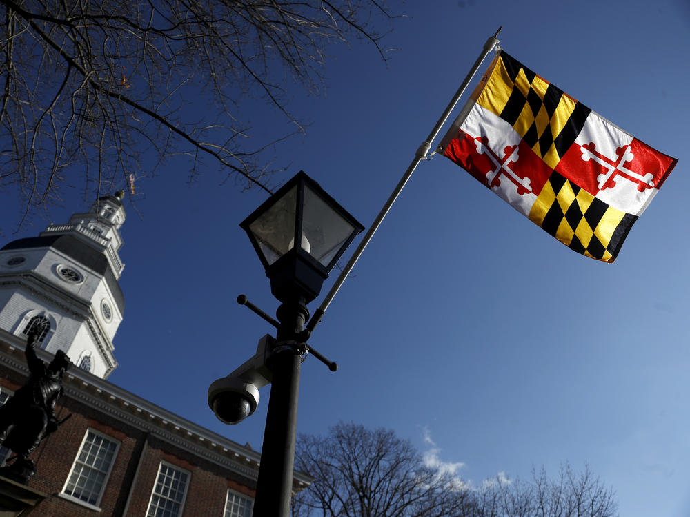 A Maryland state flag waves near the Statehouse in Annapolis. Maryland has decided to drop a state song that originated during the Civil War and alludes to Abraham Lincoln as a tyrant and a despot.