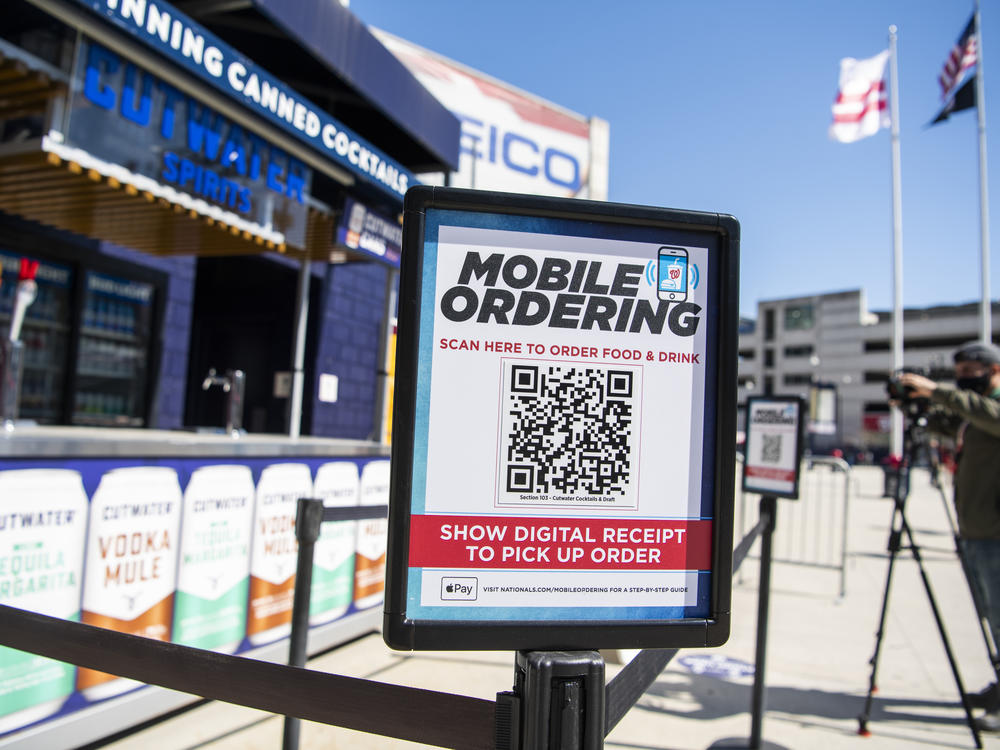A mobile ordering sign is seen on March 30 at a vending station in Nationals Park, home of the Washington Nationals. The Nats, along with many other teams in baseball, are implementing new safety protocols, including for ordering food, as a new season kicks off on Thursday.
