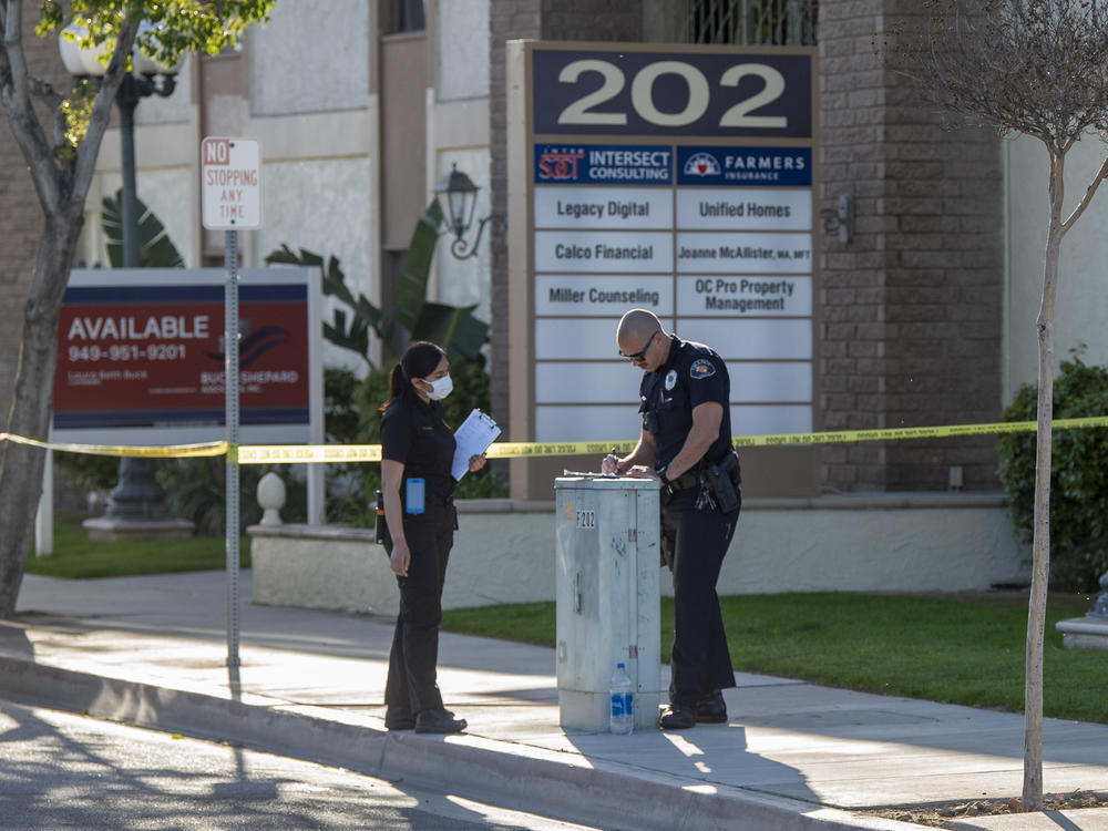 Authorities are investigating a mass shooting that killed four people and injured one at a business complex in Orange, Calif.