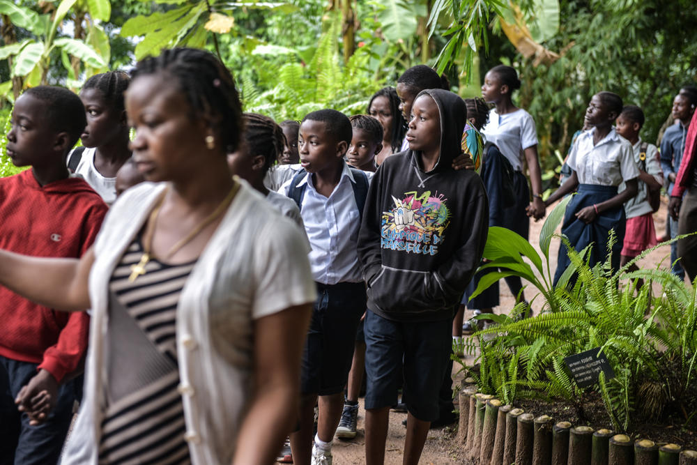 Group of school children in science class visiting Lola ya Bonobo sanctuary.