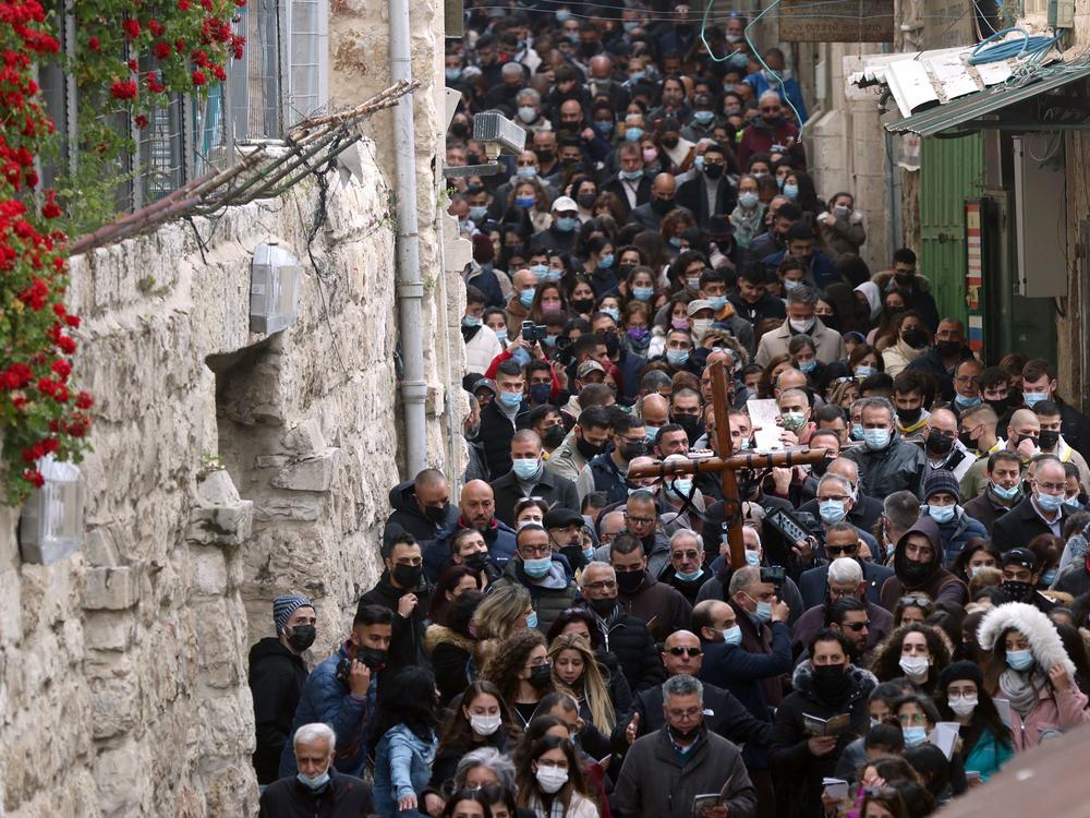 Christian worshippers carry a wooden cross on Friday along the path where tradition says Jesus took his final steps before his crucifixion in Jerusalem's Old City.