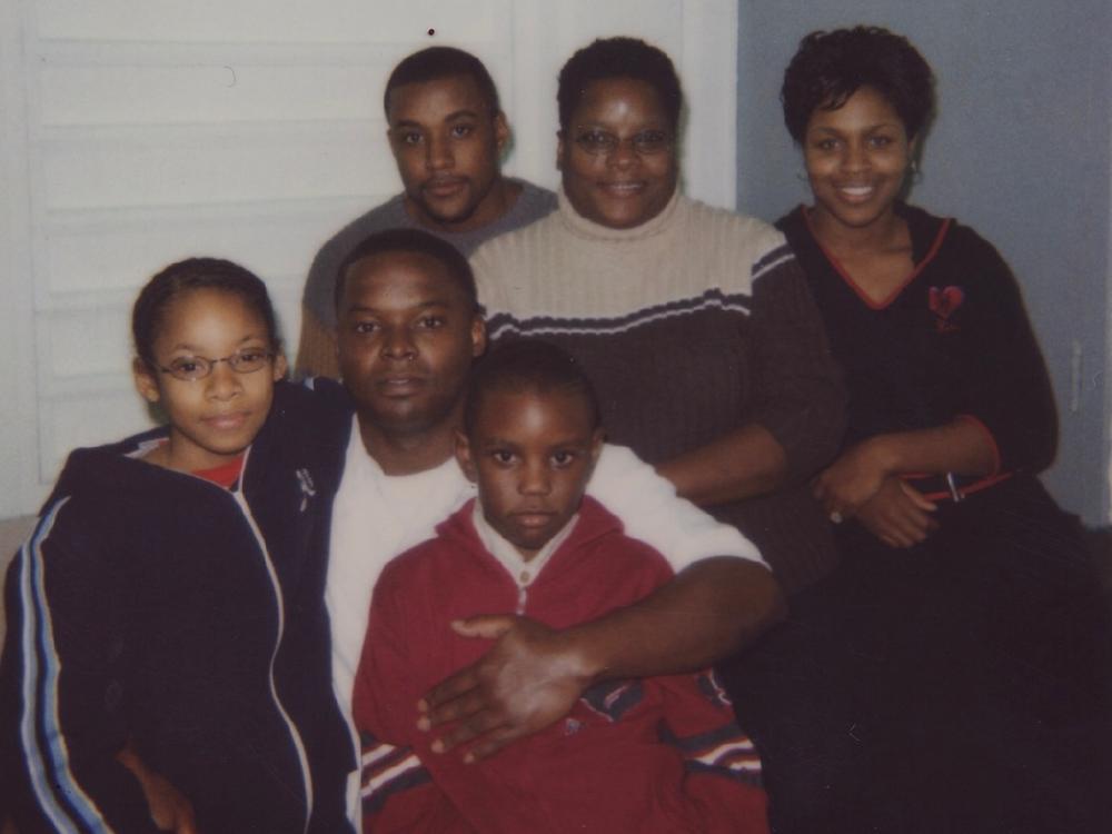 Shanaye Poole (left) next to her father, Toforest Johnson, during a family visit to see him in prison in the early 2000s.