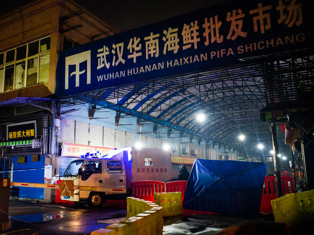 When COVID-19 first broke out in Wuhan, scientists tracked a large number of the cases to the Huanan Seafood Market in Wuhan. Above: The Wuhan Hygiene Emergency Response Team departs the market on Jan. 11, 2020, after it had been shut down to prevent the spread of the coronavirus.