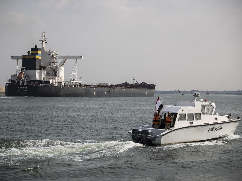 Traffic through the Suez Canal has returned to normal, the canal authority says. Here, the Huahine is seen crossing the canal on March 30 in Ismailia, Egypt.