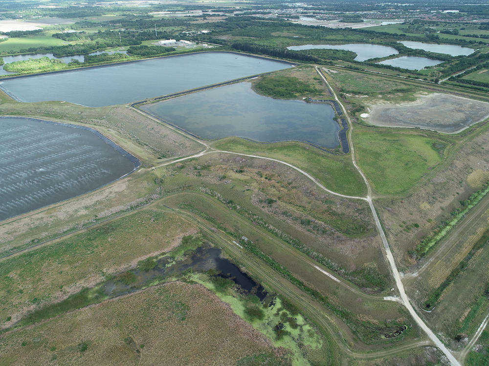A leak at the reservoir at Piney Point, an old phosphate plant in Manatee County, Fla., as shown in an aerial photo on Saturday, has prompted evacuations, environmental concerns and threats of a full-fledged breach.