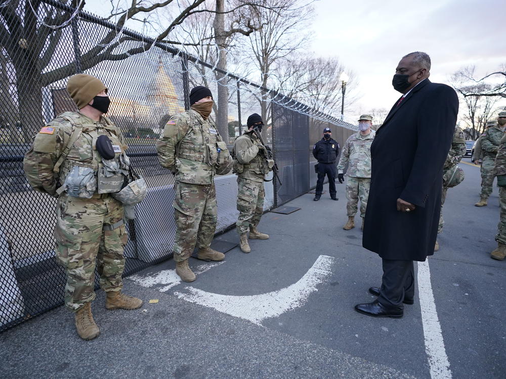 Defense Secretary Lloyd Austin visits National Guard troops deployed at the U.S. Capitol on Jan. 29. The troops were deployed in the wake of the Jan. 6 Capitol attack. Under Austin's order, all military units are holding 